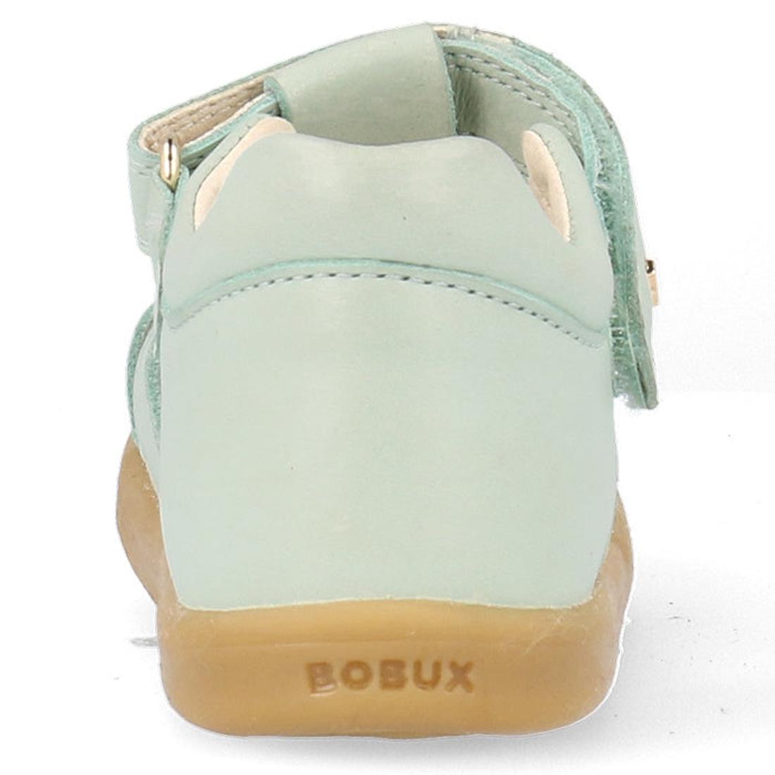 The Bobux Iwalk IW Compass Kids Mist Blue Leather Sandal 641205 is a closed-toe leather sandal for children with a beige sole, velcro strap, soft rounded design, and BOBUX branding on the heel—ideal for summer fun., 9420075708464, 9420075708471, 942007570