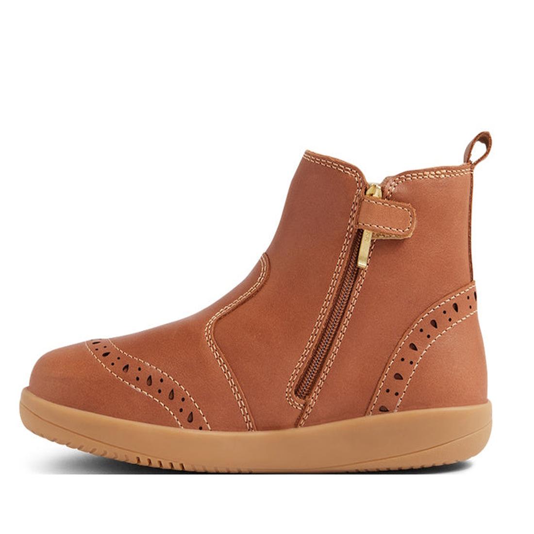 The Bobux Kid+ KP Billie 2 II Girls Leather Boot in Caramel Tan is a kids' ankle boot featuring decorative perforations, tan stitching, a flexible sole, side zipper with gold pull tab, and a back pull loop., 9420074867179, 9420074867186, 9420074867193, 94