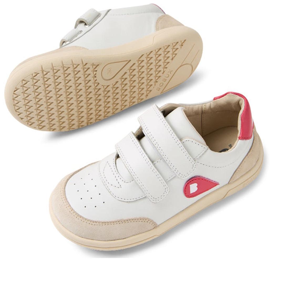 The Bobux KP Kids Plus Champ II Sneaker White Raspberry Juniors features white leather, beige soles, pink side and heel accents, adjustable Velcro straps, toe perforations, and a flexible sole—one shoe upright, the other showing its bend., 9420074829856, 