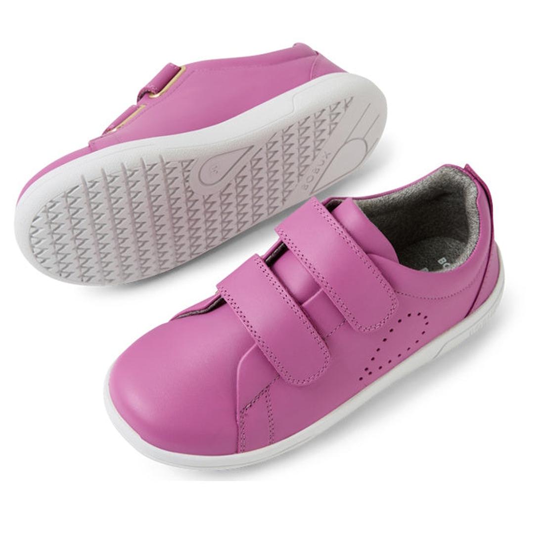 The Bobux KP Kids Plus Grass Court II Leather Sneaker in Cattleya Orchid Purple features white soles, double adjustable Velcro straps, and side perforations. One shoe is shown from the side; the other displays its textured sole., 9420074859372, 9420074859