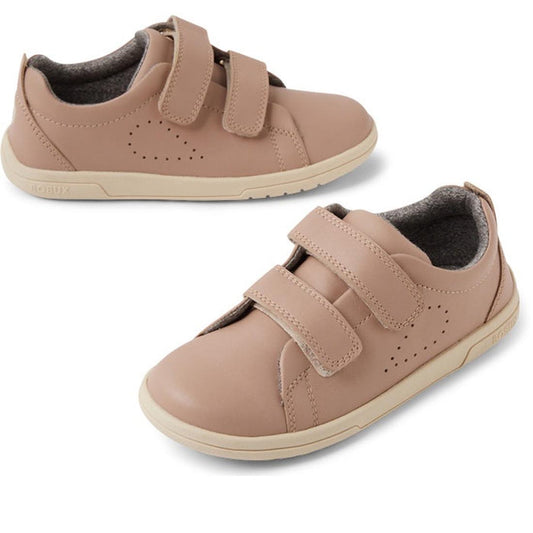 The Bobux KP Kids Plus Grass Court 2 II Leather Sneaker in Warm Taupe features double adjustable straps, perforated side details, white rubber soles, and a Bloom EVA footbed, shown against a white background.