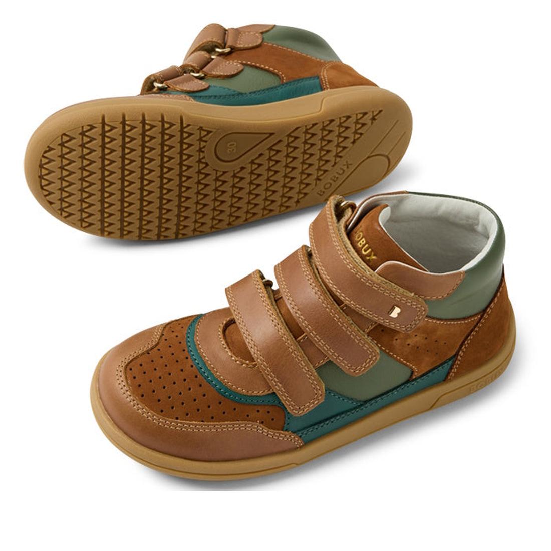 The Bobux KP Kids Plus Harley Ankle Leather Boot Caramel Tan Juniors features brown, green, and tan colors with perforated detailing, adjustable straps, and a durable sole. One boot is shown upright; the other displays its tread pattern., 9420074833716, 9