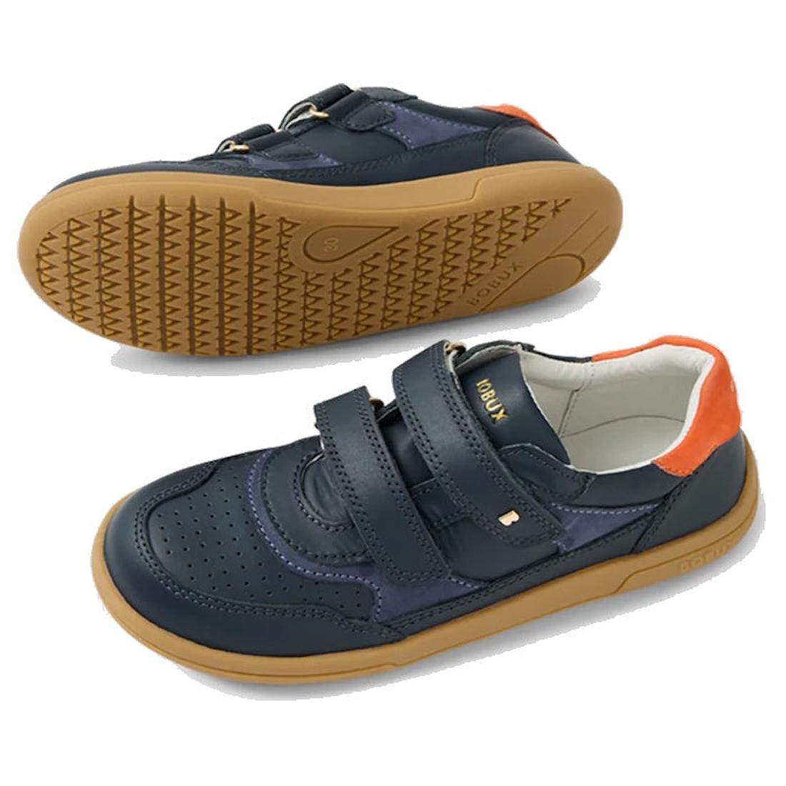 The Bobux KP Kids Plus Hunter Leather Sneaker in Navy for juniors features dark blue leather, gum soles, orange heel accents, and two Velcro straps. Shown from the side and bottom on a white background., 9420074834355, 9420074834362, 9420074834379, 942007