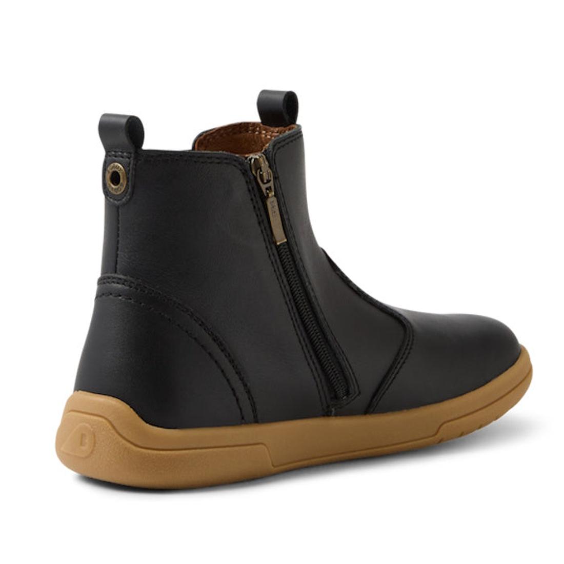 The Bobux KP Kids Plus Jodhpur II Juniors Leather Boot in Black features a tan flexible sole, visible side zipper, front and back pull tabs, and subtle stitching. Displayed at an angle to show the outer side and heel., 9420074834775, 9420074834812, 942007