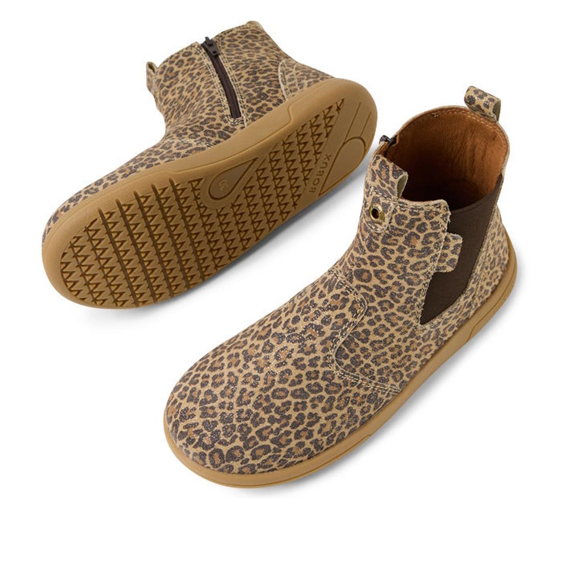 The Bobux KP Kids Plus Jodhpur II Juniors Leather Boot features a brown leopard shimmer print, ankle-high design, tan rubber soles, side elastic panels, and an inner side zipper for easy slip-on wear., 9420074834638, 9420074834645, 9420074834652, 94200748