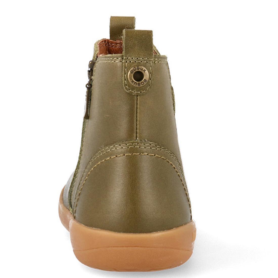 A close-up rear view of the Bobux Kid+ Jodphur Boot Olive Toffee 830060, an olive green unisex leather boot with tan stitching, brown pull tab, and light brown rubber sole set against a white background., 9420075796324, 9420075796270, 9420075796294, 94200