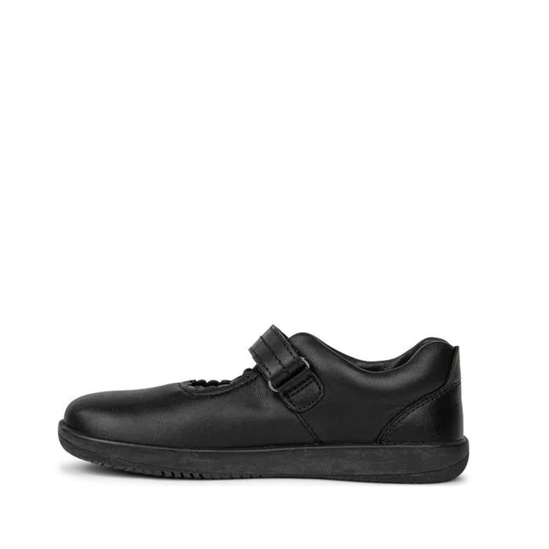 The Bobux Kid+ Black School Leather Shoe Journey Mary Jane features premium black leather, a flat sole, and a single hook-and-loop strap, displayed in profile against a white background., 9420068510630, 9420068510647, 9420068510654, 9420068510661, 9420068