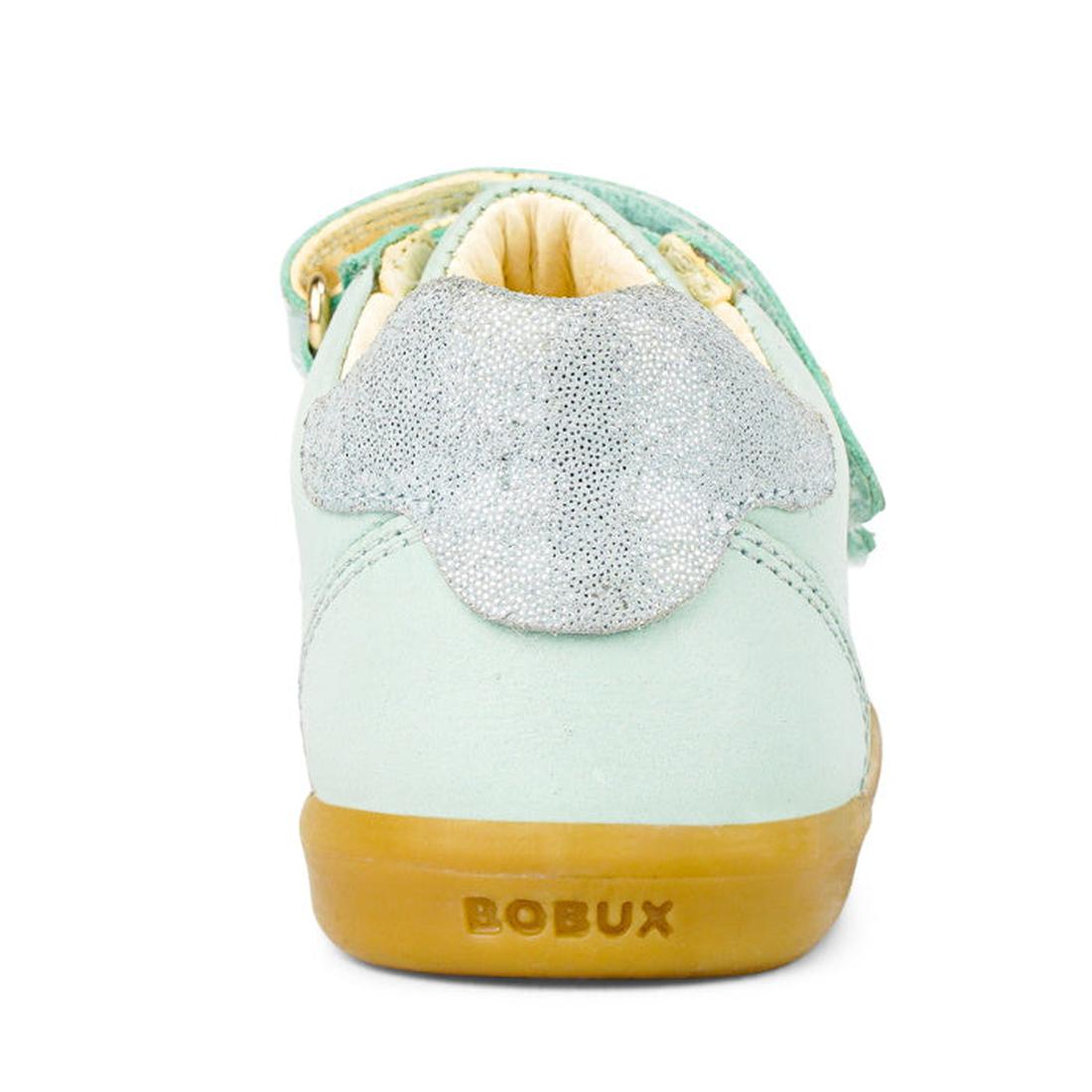 The Bobux Kids IWalk IW Sprite Sneaker in Mist Blue is a unisex children's shoe shown from the back, with a sparkly silver heel accent, tan lining, and a tan rubber sole embossed with the BOBUX brand name., 9420071311095, 9420071311101, 9420071311118, 942