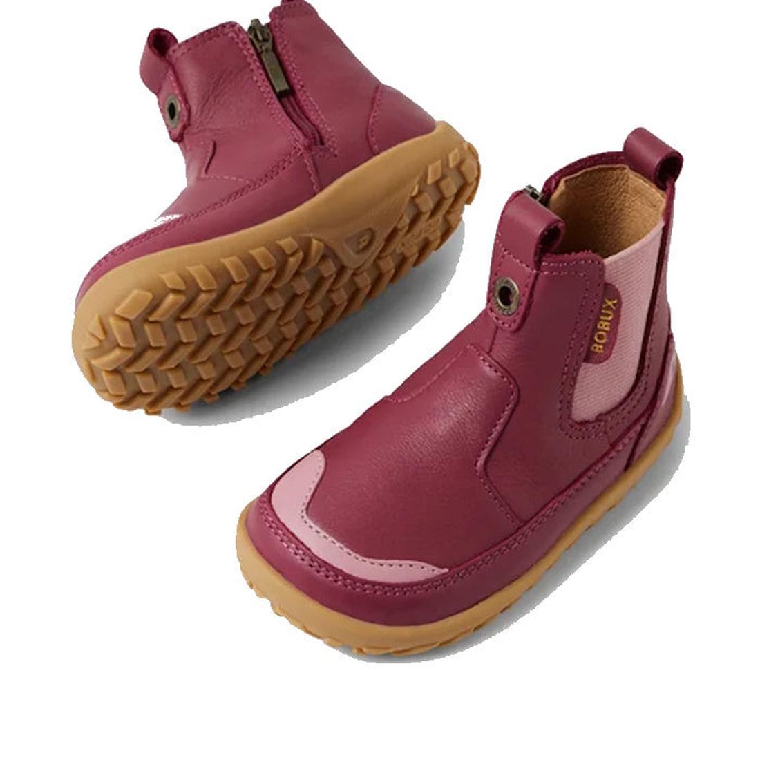 Two Bobux SU Step Up Trail Leather Boots in Beaujolias Purple with light brown rubber soles, side zippers, stretchy panels, and a barefoot-shaped toe-box—perfect for first walkers. The Bobux branding appears on one boot., 9420068578340, 9420068578357, 942