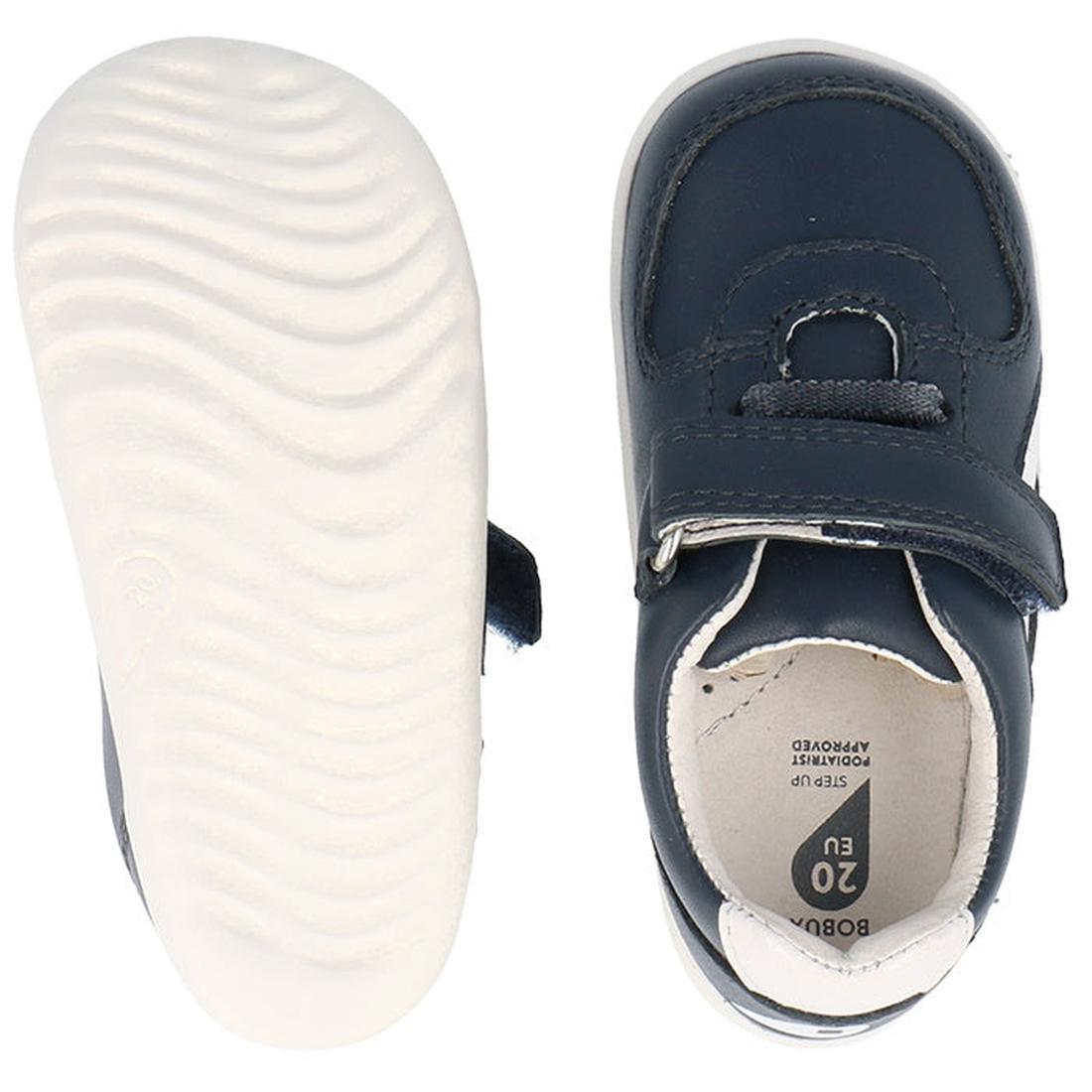 The Bobux Step Up SU Toddlers Leather Sneaker Comet Navy 734603 is shown in top and bottom views, featuring navy blue leather, flexible white soles, a hook-and-loop strap, detailed stitching, and EU size 20 marked inside., 9420075706248, 9420075706255, 94
