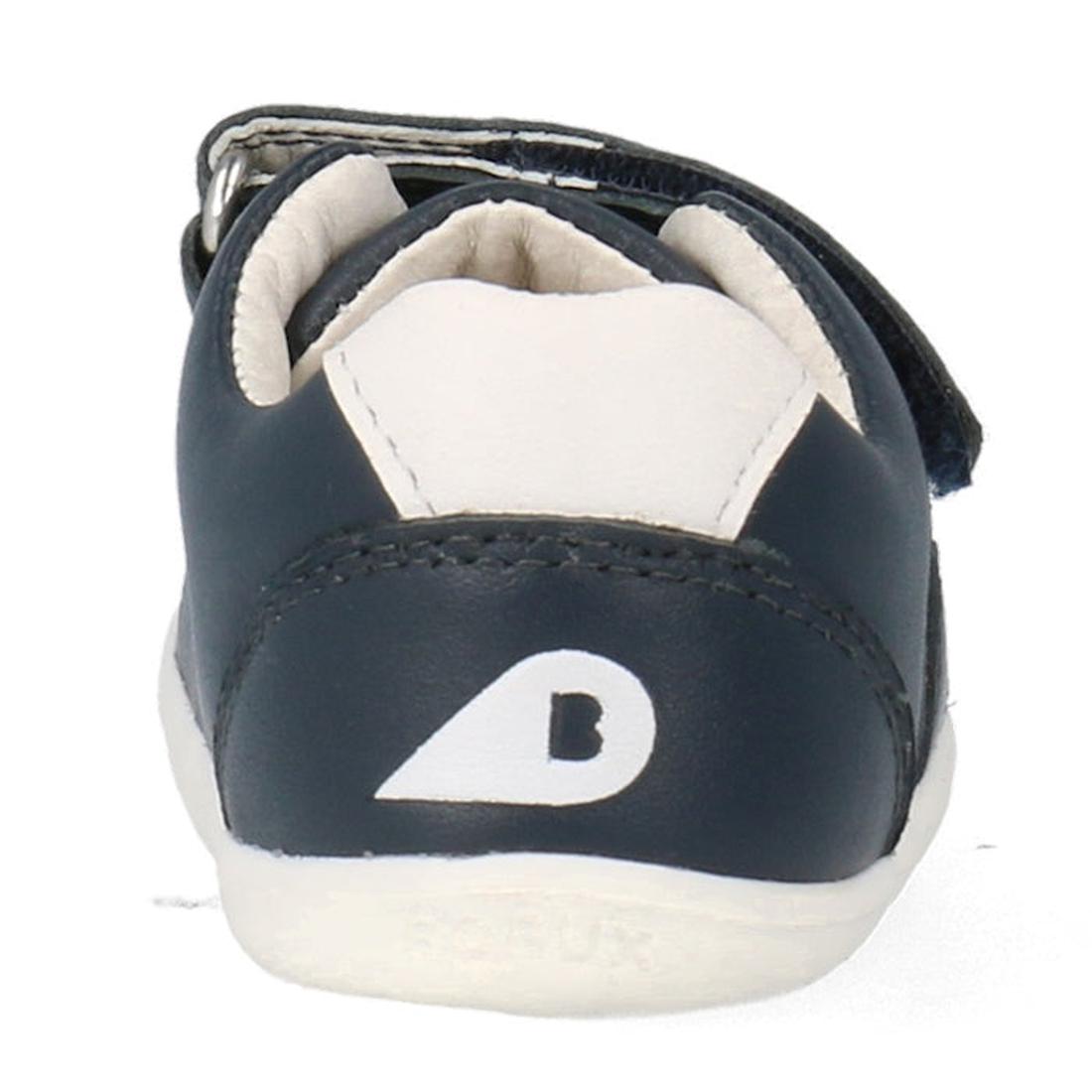 A close-up rear view of the Bobux Step Up SU Toddlers Leather Sneaker Comet Navy 734603, showing its dark blue and white design, white logo on the heel, visible ankle collar, flexible sole, and a side hook-and-loop strap., 9420075706248, 9420075706255, 94