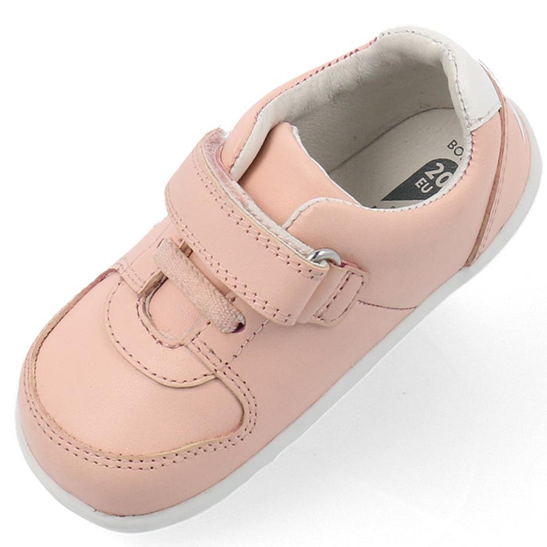 The Bobux Step Up SU Toddlers Leather Sneaker Comet Pink 734604 is shown from an angled top view, featuring a light pink color, hook-and-loop strap, white flexible sole, white inner lining, and visible shoe size on the insole., 9420075706415, 942007570642
