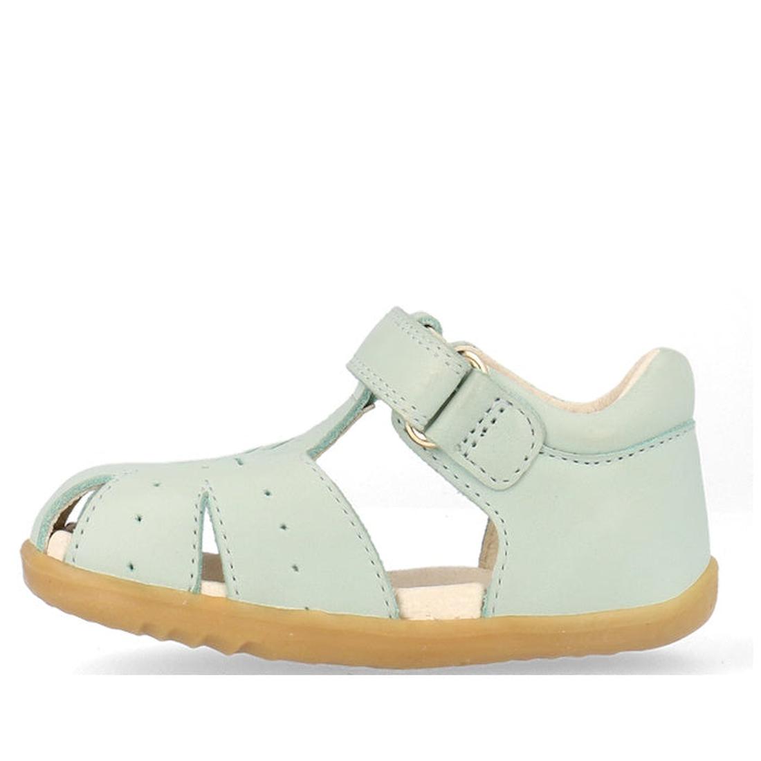 The Bobux Step Ups Compass Mist Aqua 734905 is a stylish light green closed-toe sandal for toddler girls, with a perforated upper, ankle strap, and light brown sole—perfect leather shoes inspired by Bobux’s first walker designs., 9420075708594, 9420075708