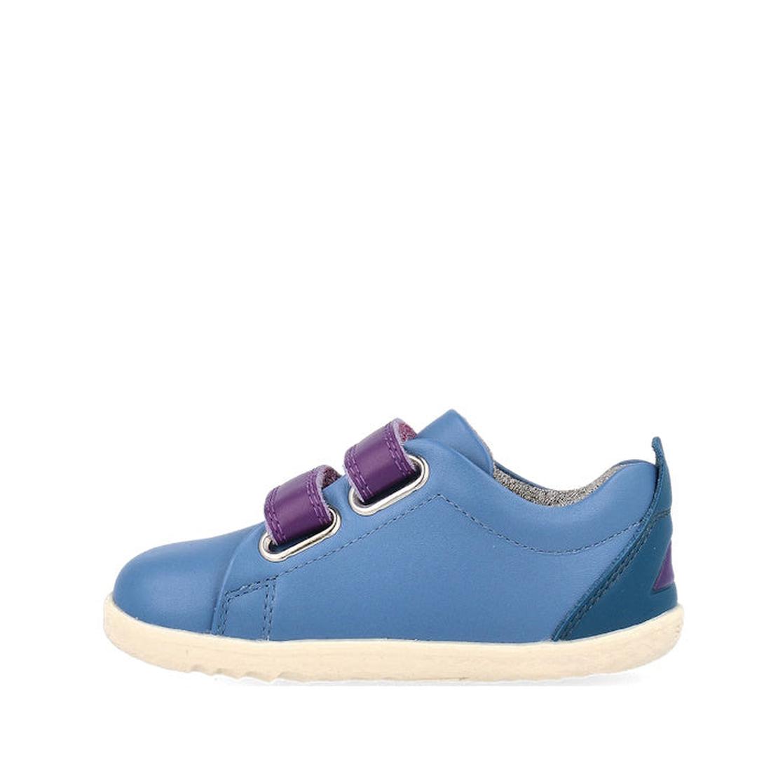 The Bobux Step Up Grass Court Trainer Elemental Blue 734205 is a toddler shoe with a leather upper, white sole, and two purple velcro straps, shown from the side on a plain white background. Ideal for growing feet., 9420075773202, 9420075768741, 942007577