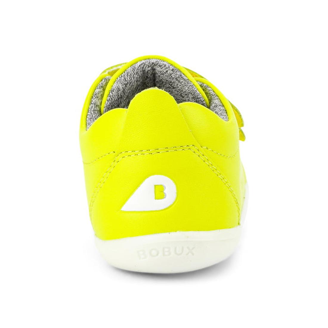 A neon yellow Bobux Step Up Grass Court Toddlers Sneaker (728941) viewed from the back, with a white sole, gray inner lining, and a white B logo above "BOBUX" on the heel., 9420068532564, 9420068532571, 9420068532588