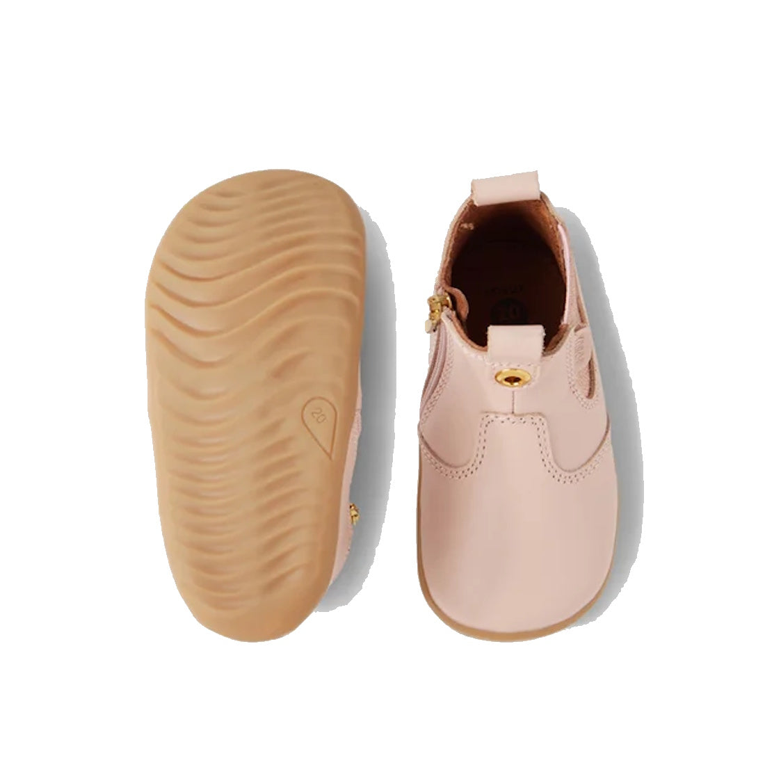The Bobux Step Up Jodhpur Boot Cameo Rose Pink is a pair of unisex first walker boots in light pink leather, featuring a soft rubber sole and a small gold side detail. Shown from both top and bottom views on a white background., 9420068539471, 94200685394