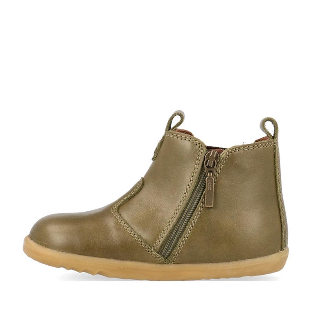 The Bobux Step Up Jodphur Boot Olive 721960 is a unisex first-walker boot in olive green leather, featuring a tan rubber sole, side zip, and front/back pull tabs for easy wear., 9420075796300, 9420075796126, 9420075796430, 9420075796553