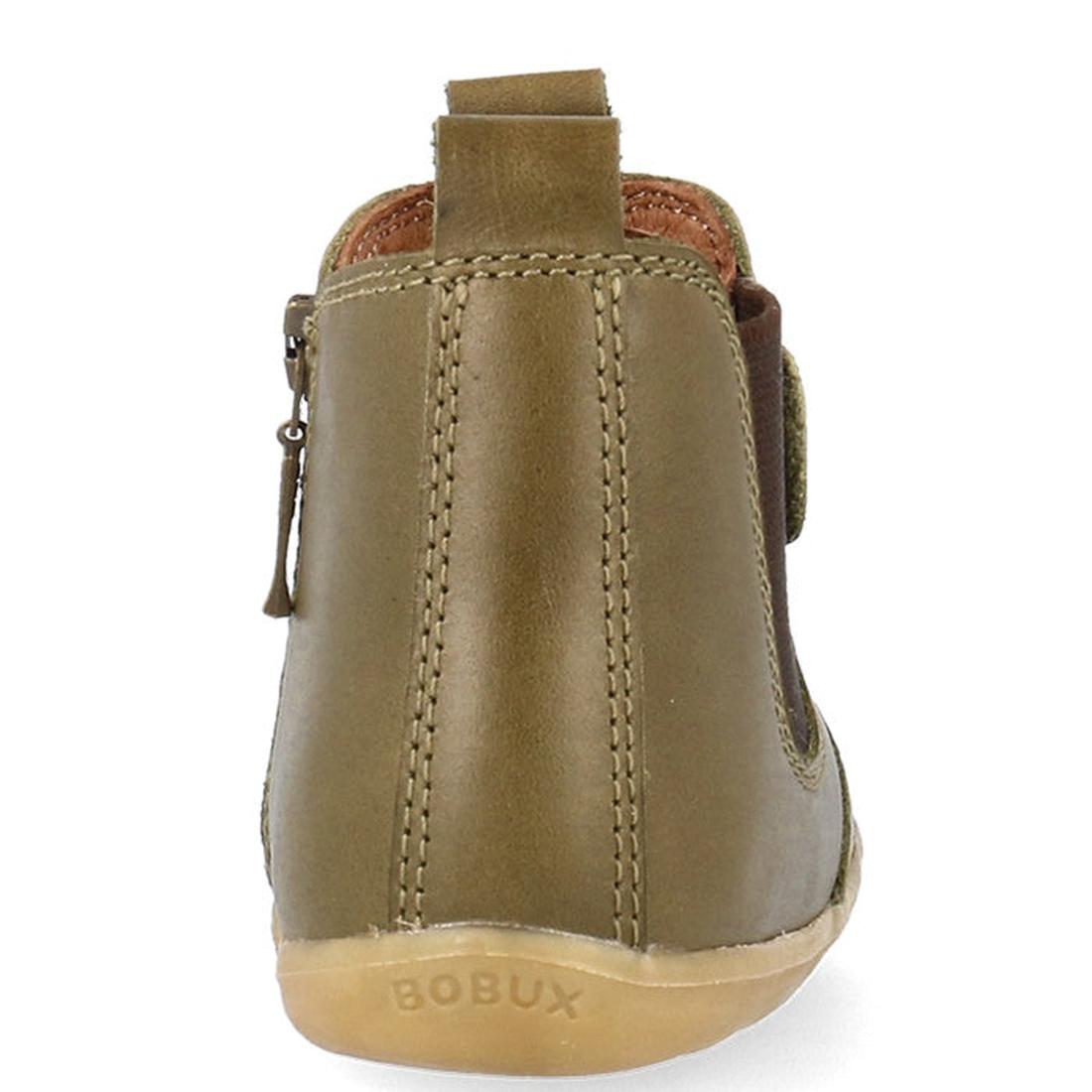 A rear view of the Bobux Step Up Jodphur Boot Olive 721960 shows an olive green unisex leather boot with tan stitching, side zipper, and BOBUX on the light brown sole—ideal for first walkers., 9420075796300, 9420075796126, 9420075796430, 9420075796553