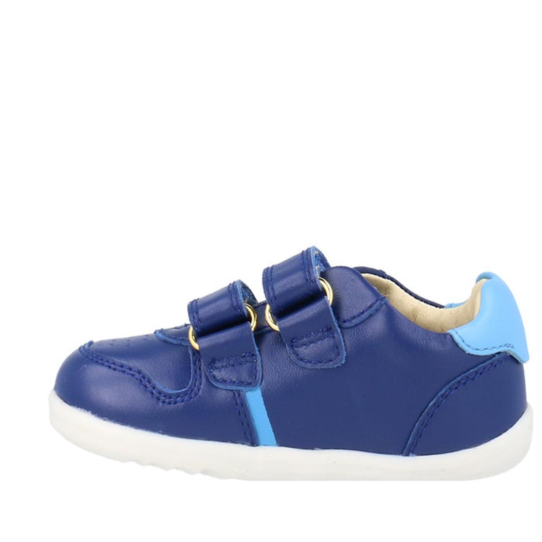 The Bobux Step Up SU Riley Sneaker Blueberry is a unisex toddler shoe with double straps, light blue accents on the heel and side, and a white sole, displayed on a plain white background., 9420075794962, 9420075794863, 9420075795112, 9420075794795