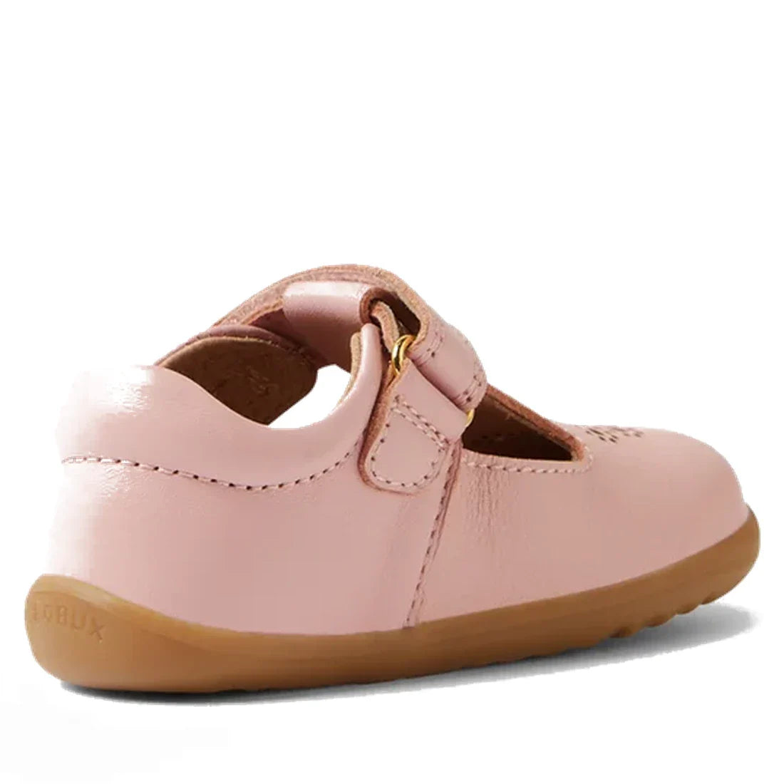 The Bobux Step Up T-Bar Rosie First Walker Shoe in Ballet Pink is a toddler leather Mary Jane with a tan rubber sole, Velcro strap, front cutout design, and visible stitching—perfect as stylish first walker shoes., 51161, 9420074849946, 9420074849953, 942