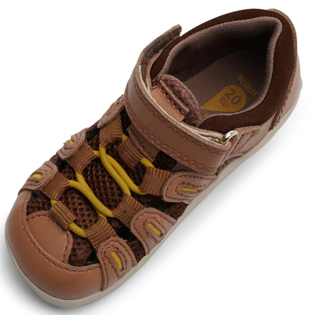 The Bobux Step Up Summit Caramel Toffee Sandal 731609 is a single brown closed-toe sandal for first walkers with mesh sides, velcro strap, yellow-accented elastic laces, and water-friendly leather, shown on a white background., 9420071313891, 942007131390