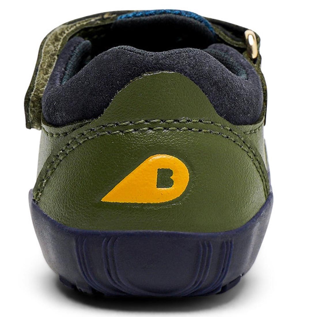 A close-up of the Bobux Step Up Toddlers Summit Forest Green Navy Sandal 731610 shows its yellow “B” logo on the heel, dark stitching, water-friendly leather, and a flexible textured sole., 9420071320165, 9420071320172, 9420071320189, 9420071320196