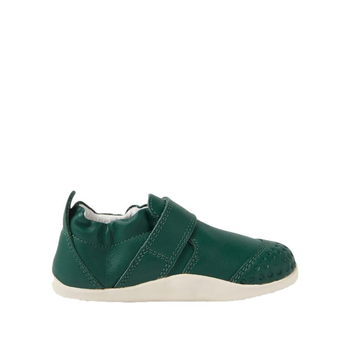 A single Bobux XP Xplorer First Walking Shoe in Mediterranean Green for toddlers, featuring a flexible sole, white trim, velcro strap, textured toe area, and heel pull tab, shown from the side on a white background., 9420074808820, 9420074808837, 94200748