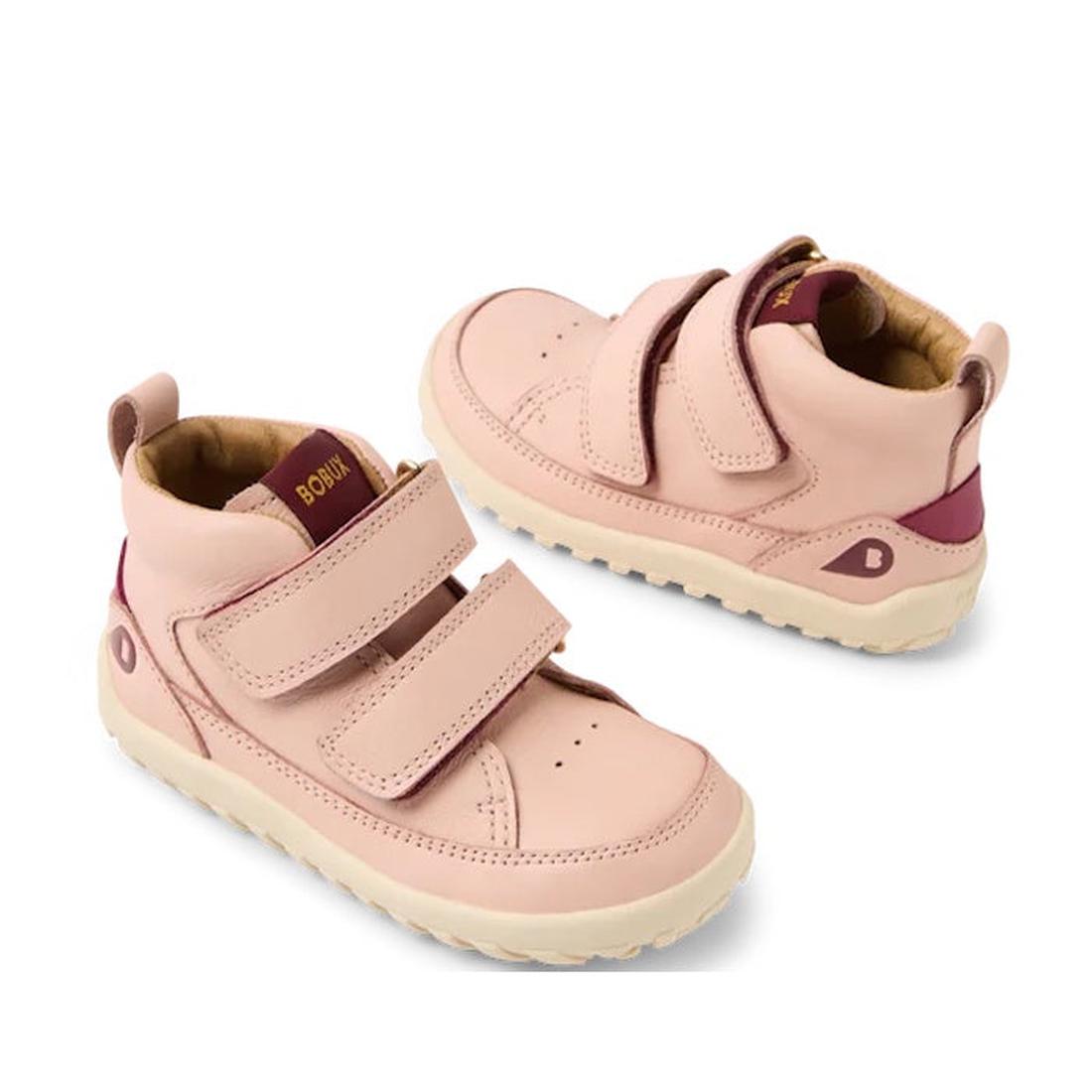 The Bobux IW Iwalk Trek Leather Boot Cameo Rose Pink 635803 features a barefoot-shaped toe box, cream soles, maroon heel and tongue accents, and two hook-and-loop velcro straps.