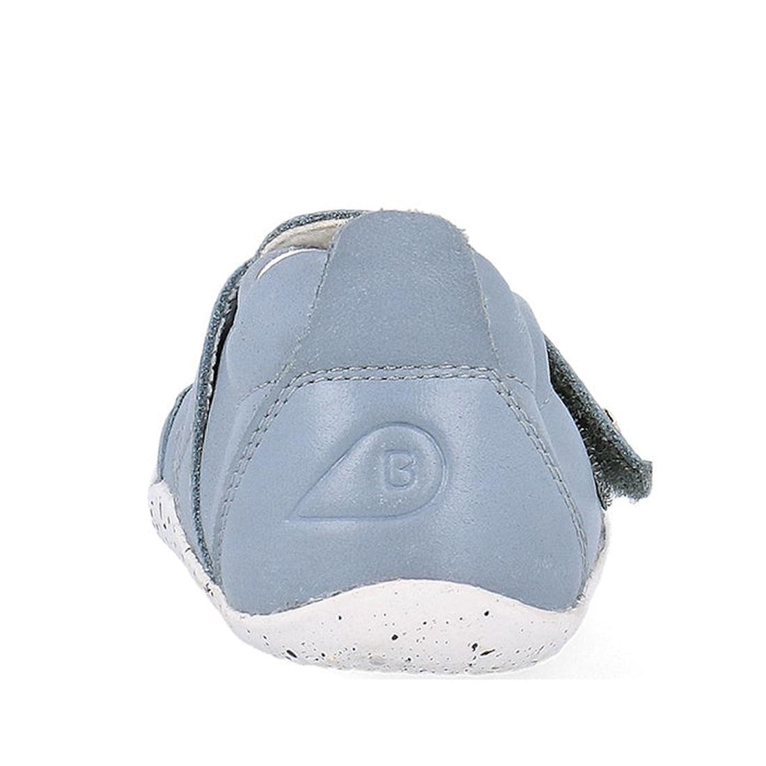 A close-up of the Bobux XP Explorer Beau First Walker Sandal 502303 shows its light blue color, flexible sole, white speckled detail, B logo on the heel, and soft stitched material—ideal for toddlers learning to walk., 9420075784628, 9420075784994, 942007
