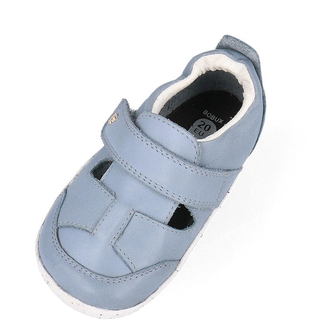 The Bobux XP Explorer Beau First Walker Sandal 502303 is a light blue learning-to-walk shoe with velcro strap, cutout design, soft white flexible sole and inner lining, shown from above on a white background., 9420075784628, 9420075784994, 9420075783652, 