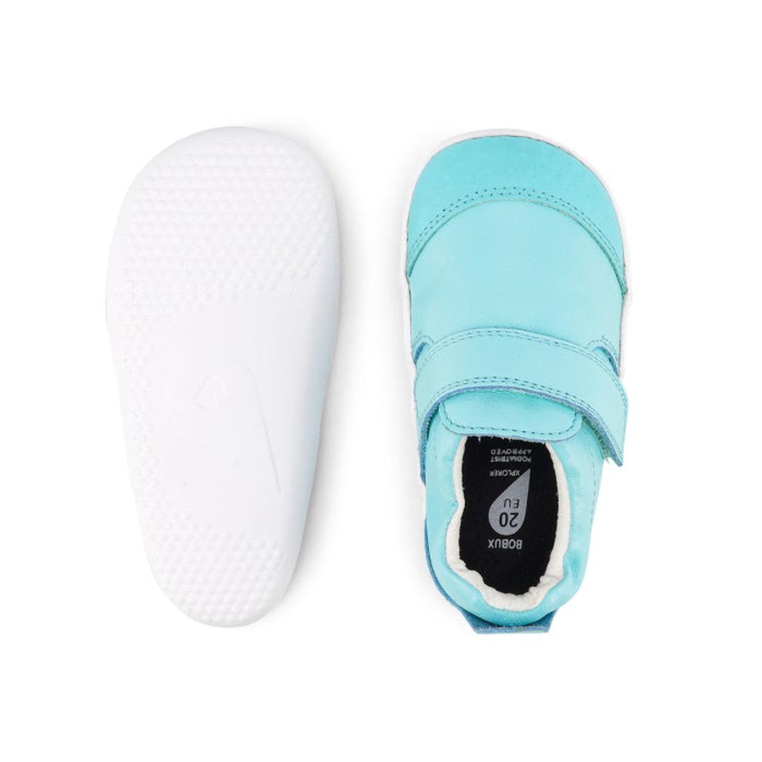 The Bobux Xplorer Go Aqua First Walker Crawler shoes are shown in light blue from top and bottom views, featuring a Velcro strap on top and a flexible, white textured sole for comfort and support., 9420068531673, 9420068531680, 9420068531697, 942006853170