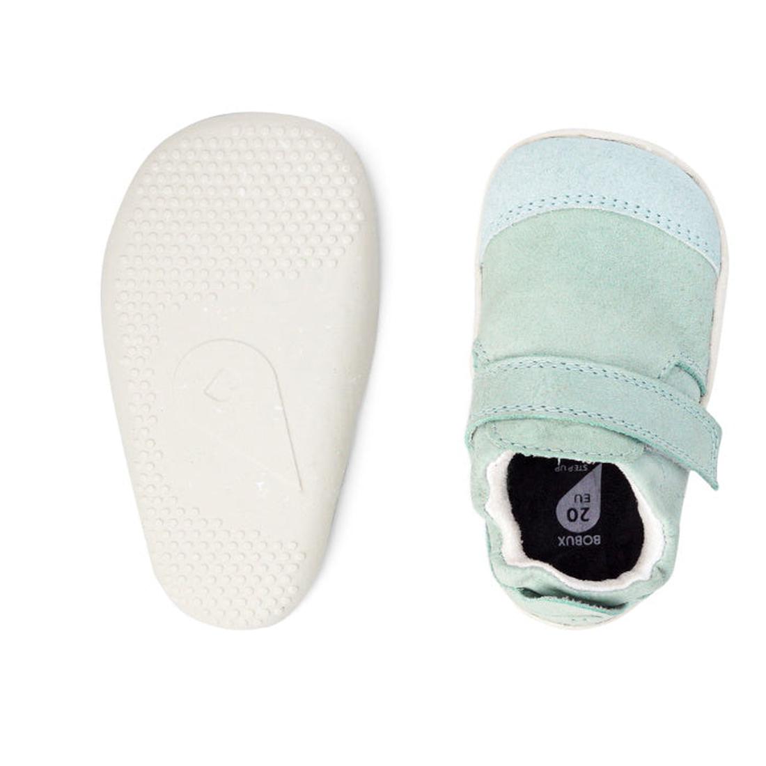 The Bobux XP Xplorer Marvel Mist Blue Dress Shoe First Walker 501227 is shown from above in pale green and light blue sheep leather with a velcro strap, scuff-resistant suede toe cap, and a white flexible non-slip textured sole., 9420071309627, 9420071309