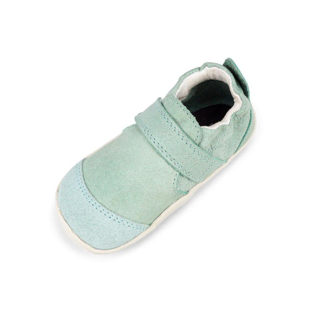The Bobux XP Xplorer Marvel Mist Blue Dress Shoe First Walker 501227 is a single mint green baby shoe made from soft sheep leather with a scuff-resistant suede toe cap, rounded flexible sole, hook-and-loop strap, and white lining on a white background., 9