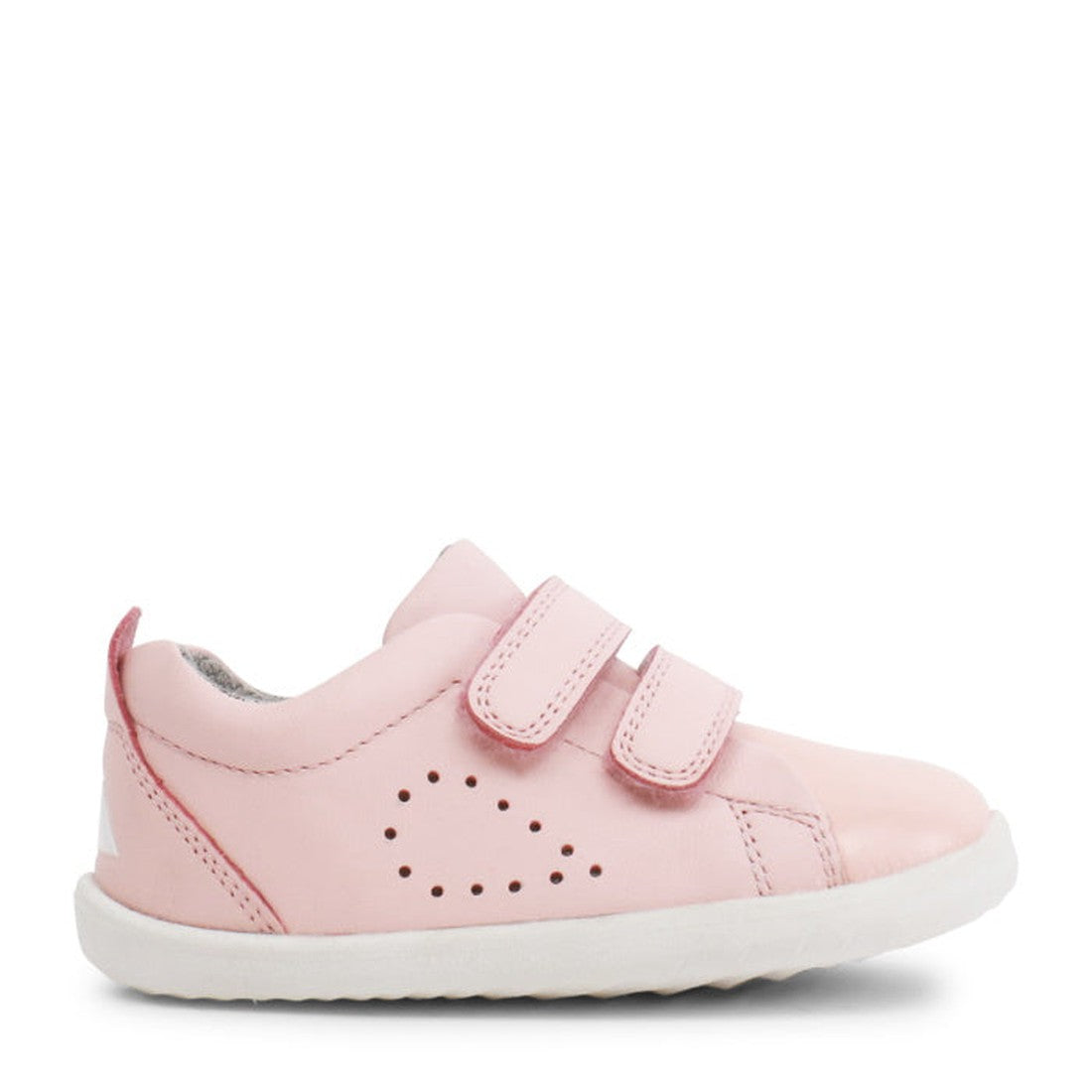 The Bobux Step Up SU Grass Court Trainer 728909J in Seashell Pink features two adjustable Velcro straps, a white sole, and heart-shaped perforations—perfect leather sneakers for toddlers taking their first steps., 9420075792913, 9420075792333, 94200757898