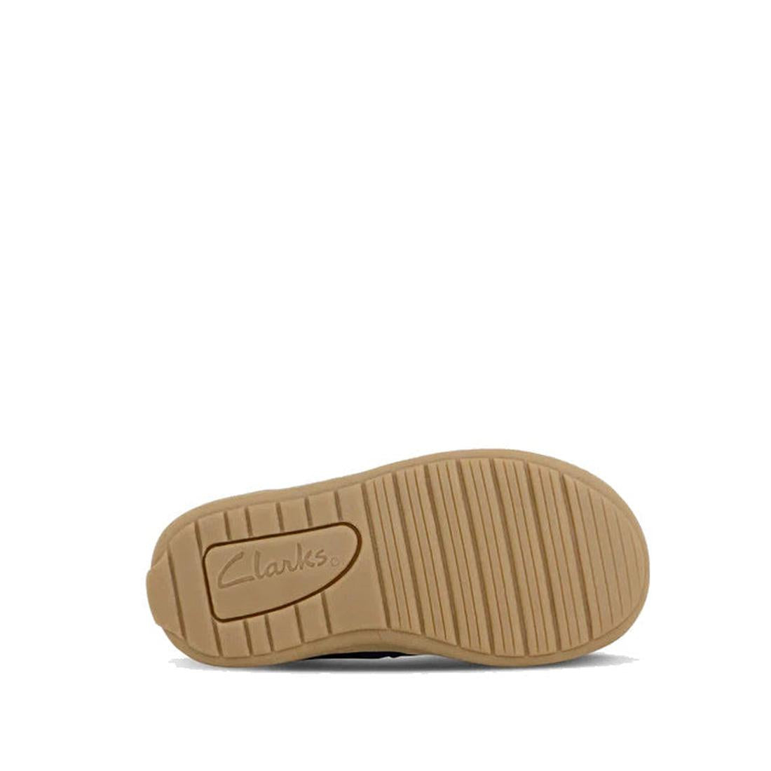 The beige rubber sole of the Clarks Kids Marcela Leather Boot Navy E Width Average, with Clarks logo embossing and horizontal grooves, is photographed on a white background—the perfect finish for these girls’ leather upper butterfly boots., 36303, 9336078