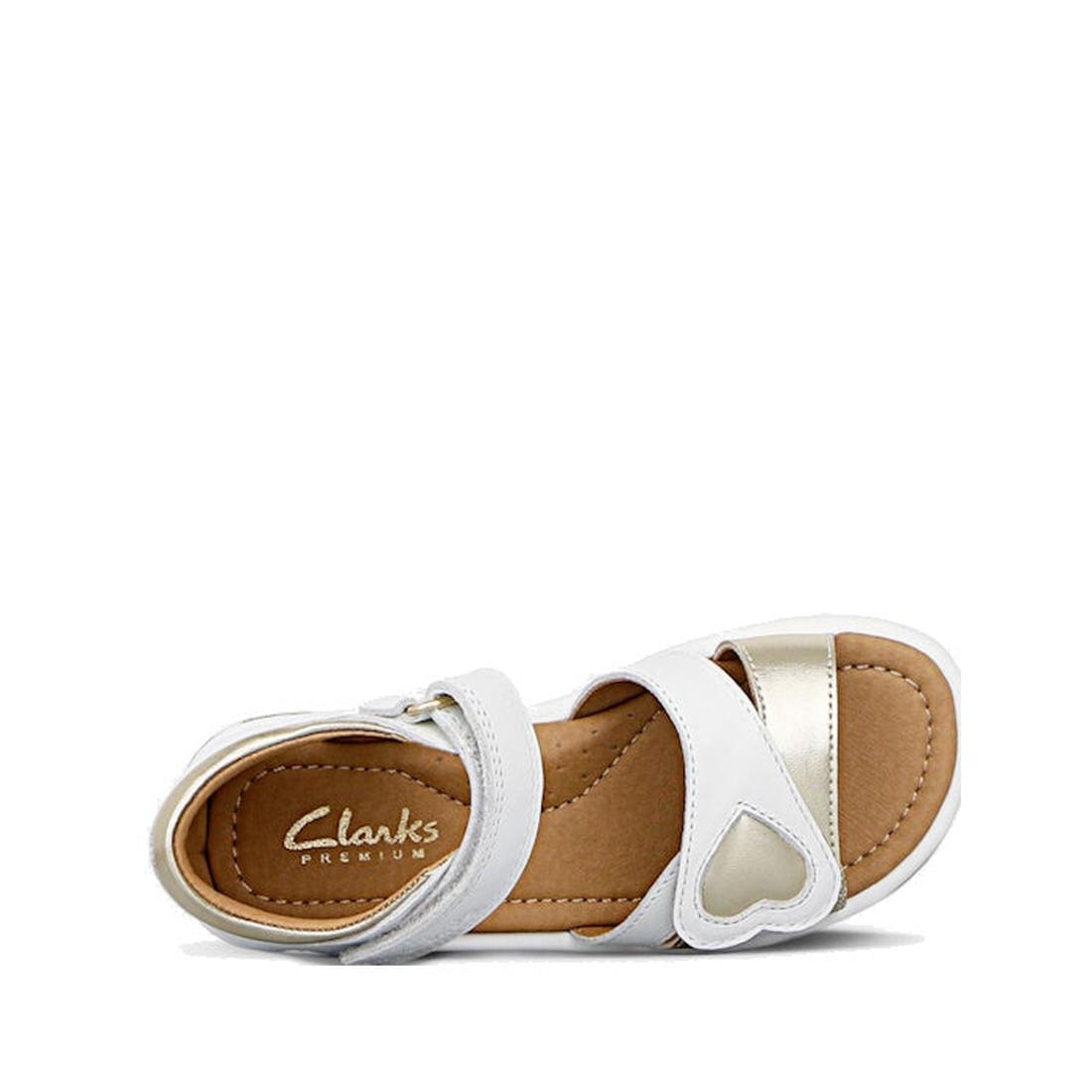 The Clarks Girls Pippa White Leather Sandals (E Width) feature gold accents, Velcro straps, a heart detail, leather upper, and a tan insole with Clarks Premium branding—perfect for adjustable comfort and style for growing feet., 9336078233325, 93360782333