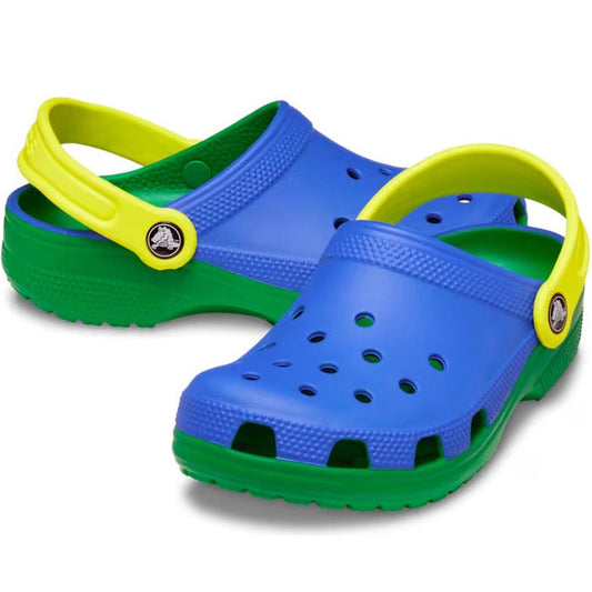 The Crocs Kids Youths Retro Sport Classic Clog K features a bold color block design in blue, green, and yellow with ventilation holes on the top and sides plus yellow heel straps for style and comfort.