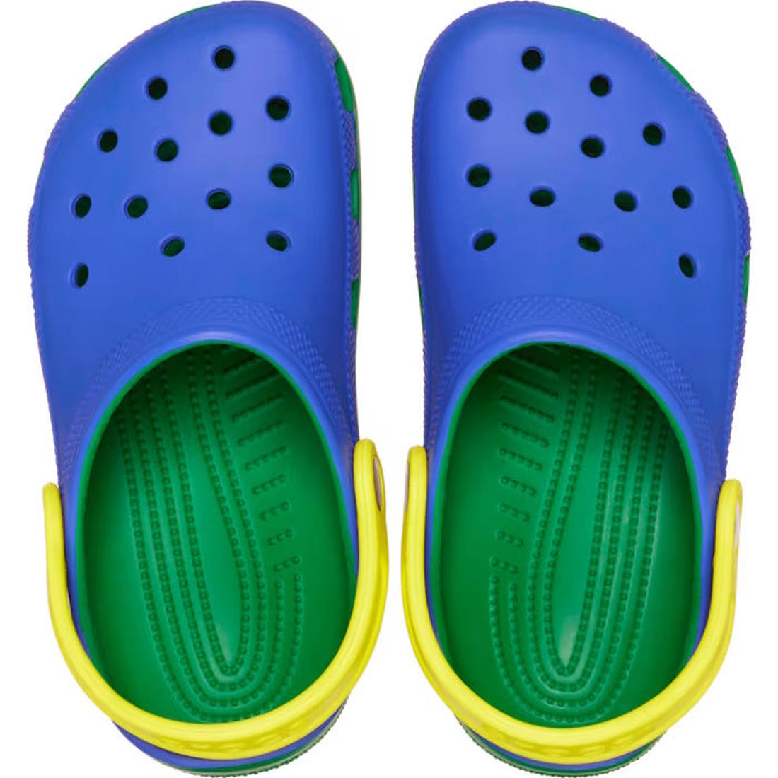 A pair of Crocs Kids - Youths Retro Sport Classic Clog K Blue Bolt Green Yellow Sandals, viewed from above, featuring bold color blocking and top ventilation holes., 198445214431, 198445214448, 198445214455, 198445214462, 198445214479, 198445214486, 19844