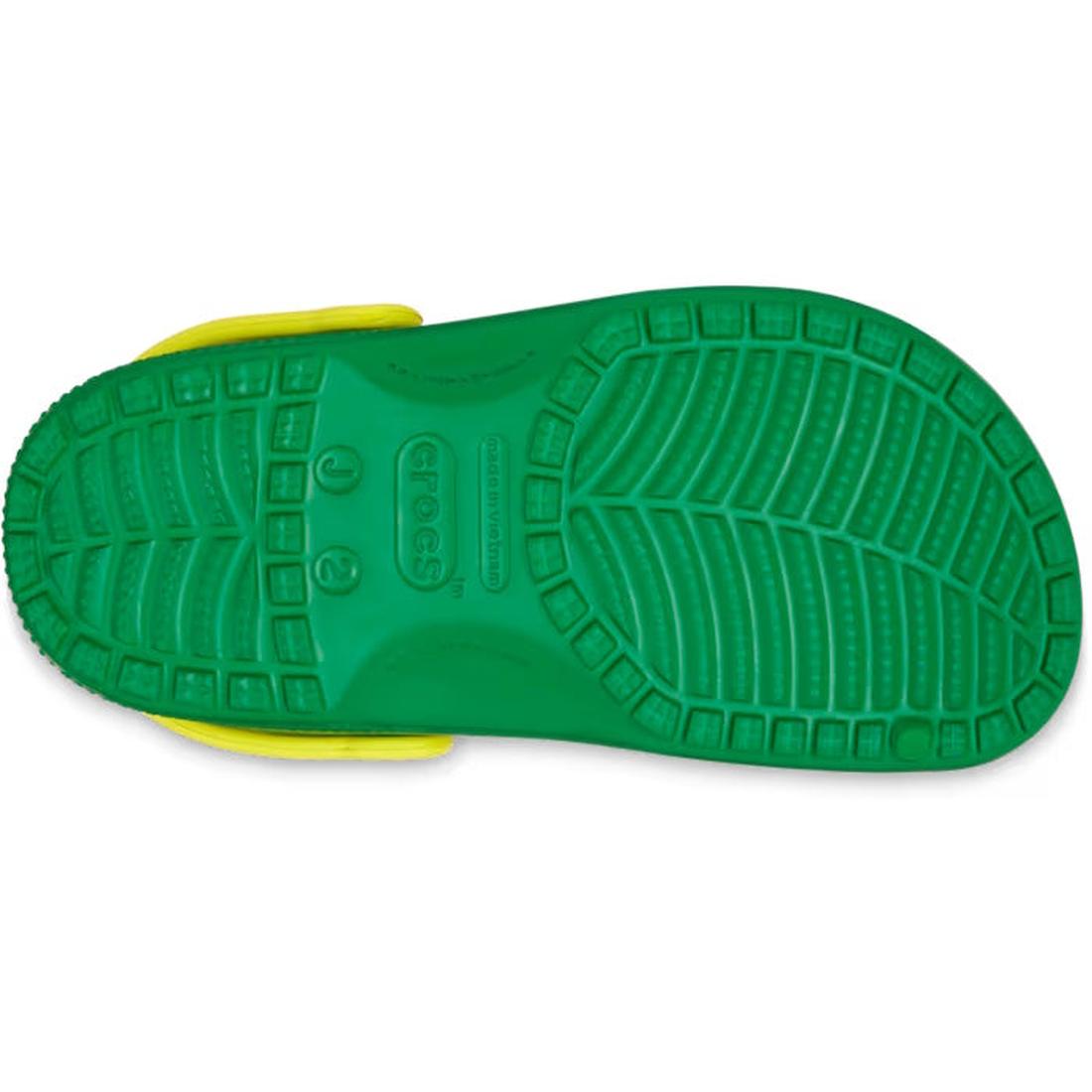 The image shows the sole of a Crocs Kids - Youths Retro Sport Classic Clog K Blue Bolt Green Yellow Sandal, featuring a detailed tread pattern, color-block design, and visible Crocs logo in the center., 198445214431, 198445214448, 198445214455, 1984452144