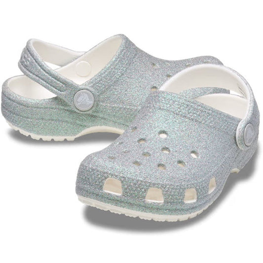 Crocs Kids - Classic Iridescent Glitter Clog White brings silver sparkle, a comfy white sole, and secure heel straps for growing kids.  ksnz