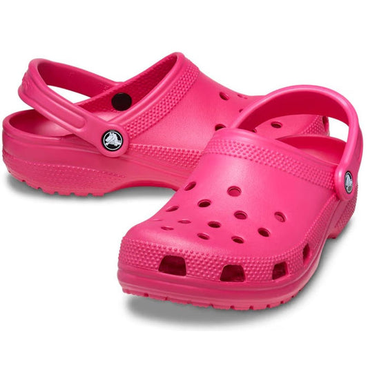 The Crocs Classic Clog in bright pink for adults, with easy heel straps, non-slip soles, and comfy ventilation. Shoes slightly overlap.  ksnz