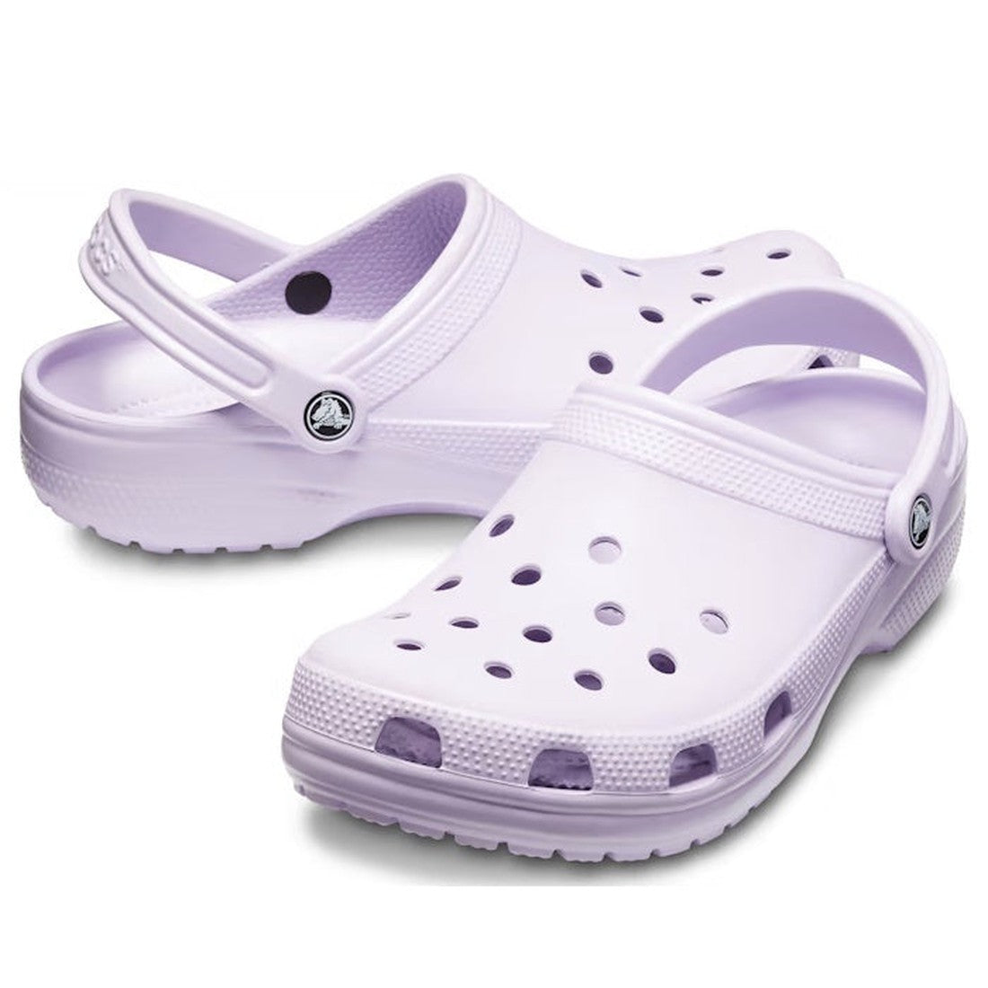 The Crocs - Classic Clog Lavender Adults, a comfy slip-on shoe in soft lavender with grippy sole, heel strap, and airy holes.  ksnz