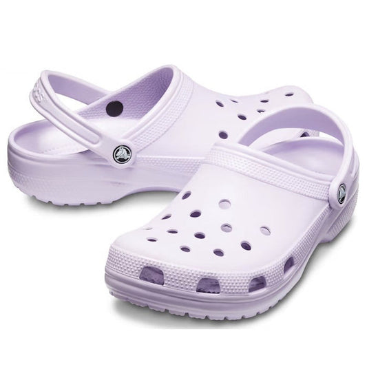 The Crocs - Classic Clog Lavender Adults, a comfy slip-on shoe in soft lavender with grippy sole, heel strap, and airy holes.  ksnz