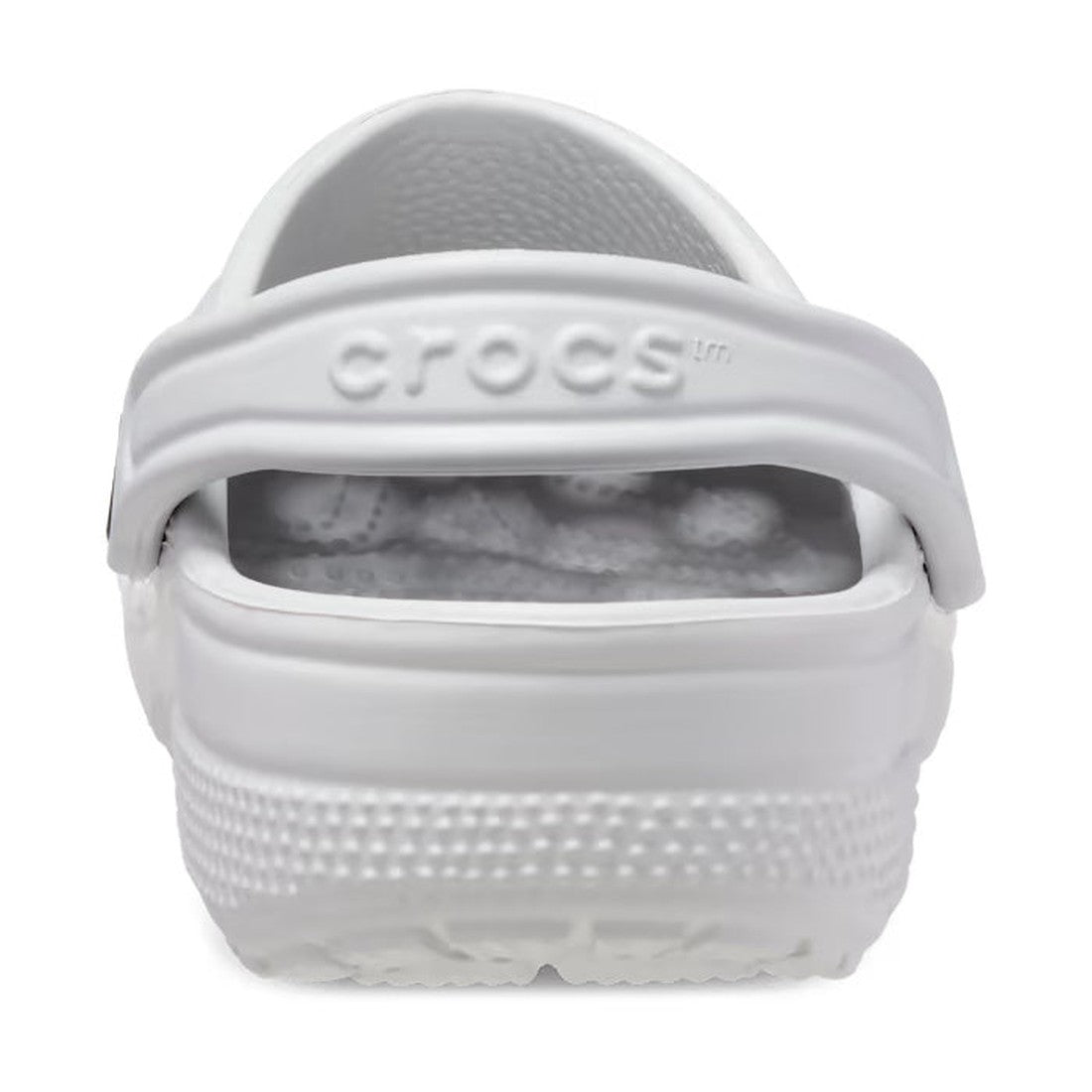 A close-up rear view of a Crocs - Classic Clog Atmosphere Light Grey Adults shows the textured sole and heel strap with the raised CROCS logo, designed for lightweight comfort in unisex clogs., 28052, 196265207671, 196265207688, 196265207695, 196265207701