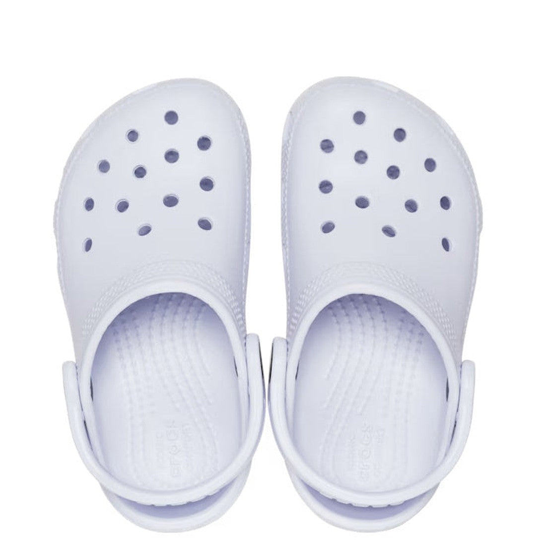 A pair of Crocs Kids - Classic Clog Dreamscape Purple slip-ons for junior youths, featuring round ventilation holes and adjustable back straps, viewed from above against a white background., 196265549948, 196265549955, 196265549962, 196265549979, 19626554