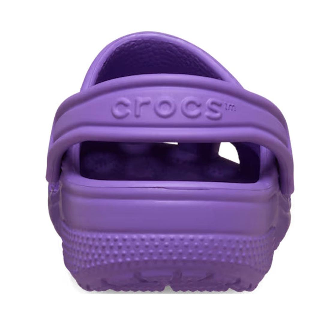 A rear view of the Crocs Kids - Classic Clog Purple - Junior Youths Sizes displays the textured sole, heel strap, and embossed CROCS logo; this water-friendly kids clog is ideal for everyday adventures., 198445337628, 198445337635, 198445337642, 198445337