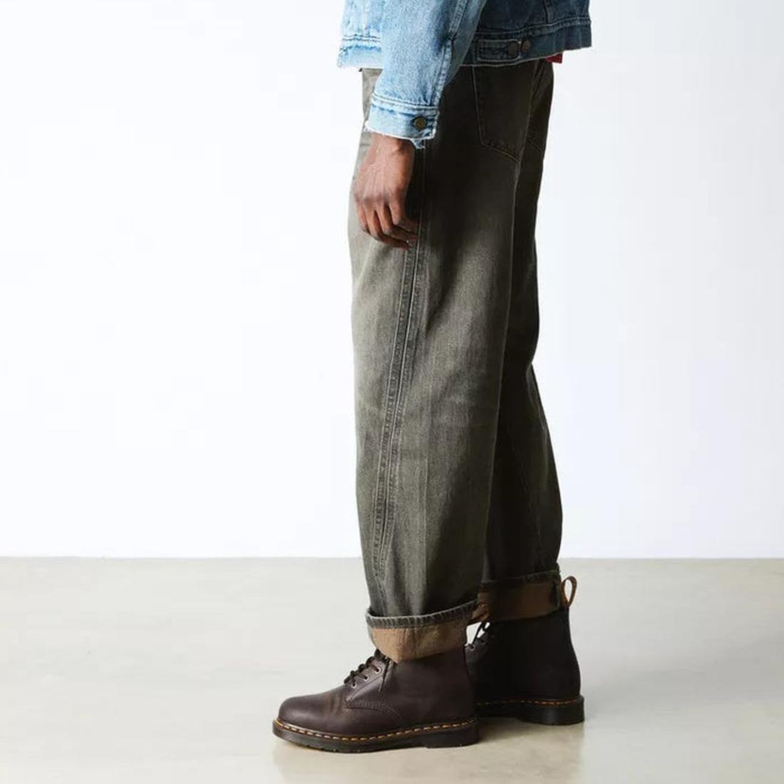 Person wearing green jeans and Dr Martens 6 eye 101 crazy horse brown boots on a white background.,
190665488418,
190665488425,
190665488449,
190665488456,
190665488463,, 46217, 46218, 190665488418, 190665488425, 190665488449, 190665488456, 190665488463, 
