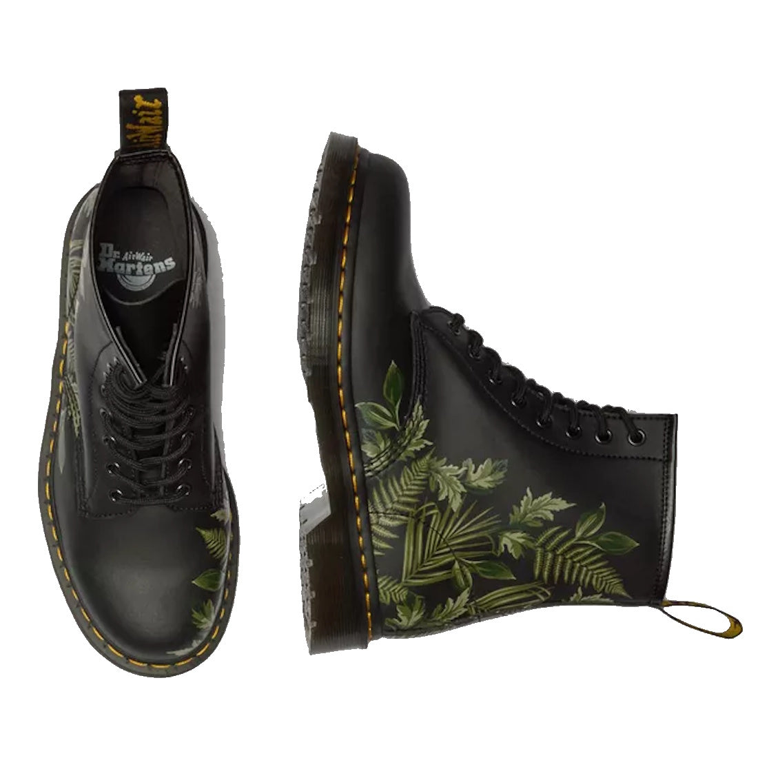 A pair of 1460 Dr. Martens Smooth EverGreen Leather 8 Up Boots featuring green leaves on a black background, yellow stitching, and shown from both top and side views.