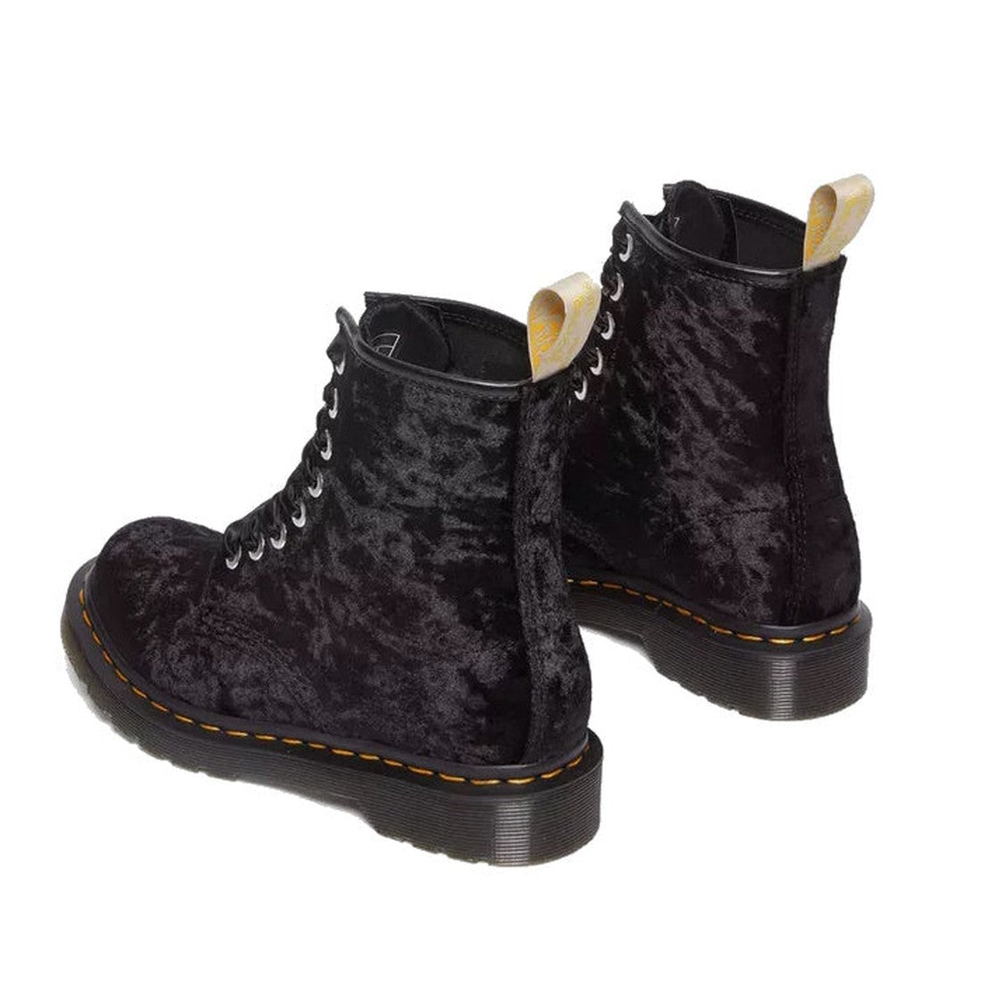 The Dr Martens 1460 Vegan Black Crushed Velvet 8 Eye Boot features black crushed velvet, yellow stitching around the sole, and yellow pull tabs on the back, shown against a white background., 190665580938, 190665580945, 190665580952, 190665580969, 1906655
