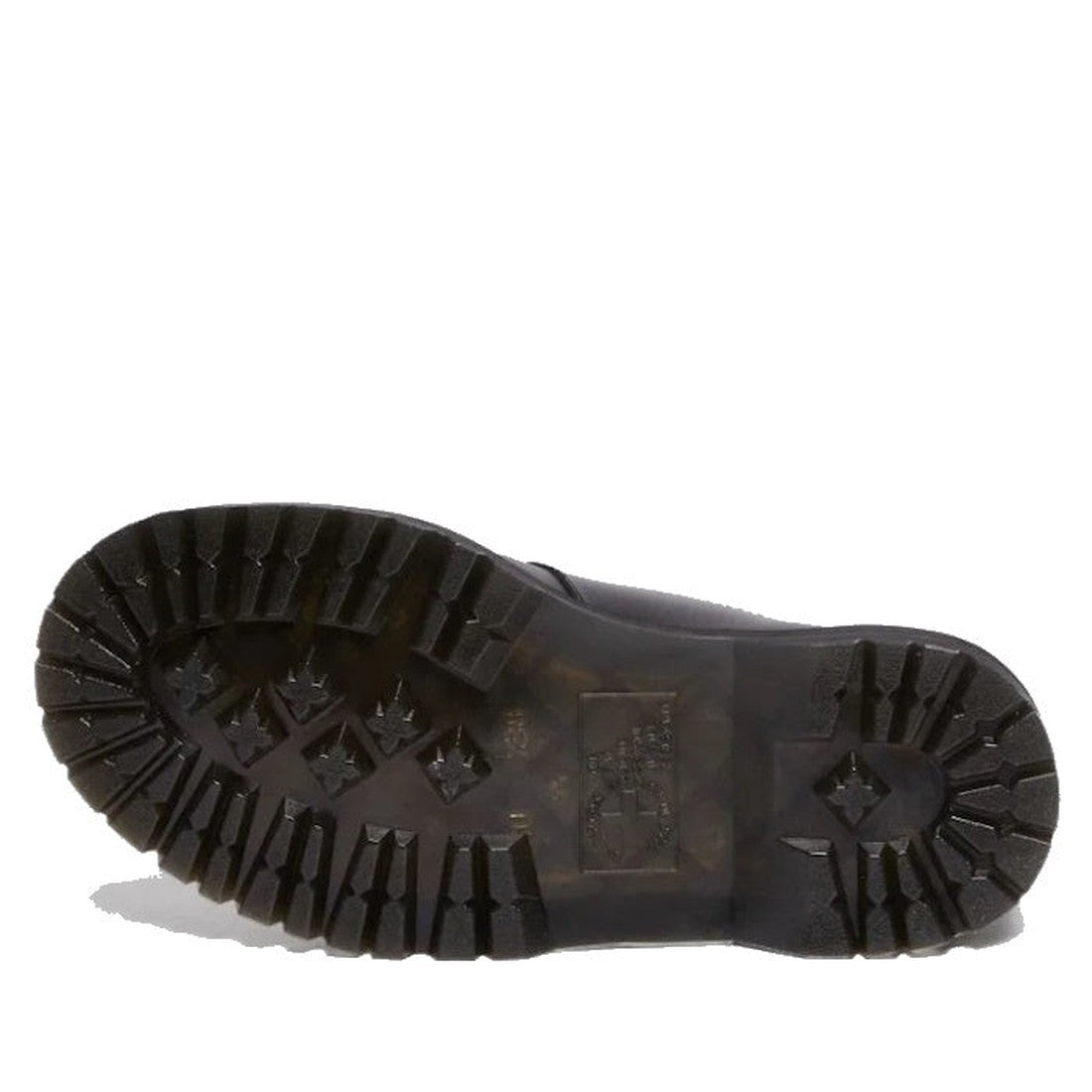 The image displays the rugged black BEX sole of the Dr Martens Bex 8065 II 2 Strap Mary Jane Shoe, featuring wide deep grooves and star-shaped indentations for traction, with slight wear visible next to the smooth leather upper., 190665536799, 19066553680